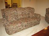 Sofa with two recliners' floral fabric