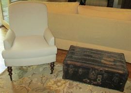 There are two large, domed trunks for sale in addition to the flat trunk pictured