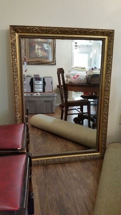 Ornate framed mirror with beveled edge