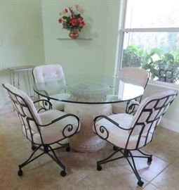 Kitchen Dining Table with Greek Pedestal Design and 4 Black Metal Caster Chairs.