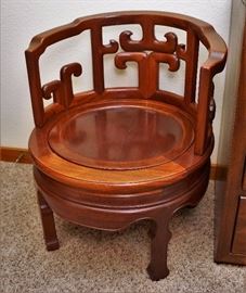 One of two circular mahogany chairs with removable seats
