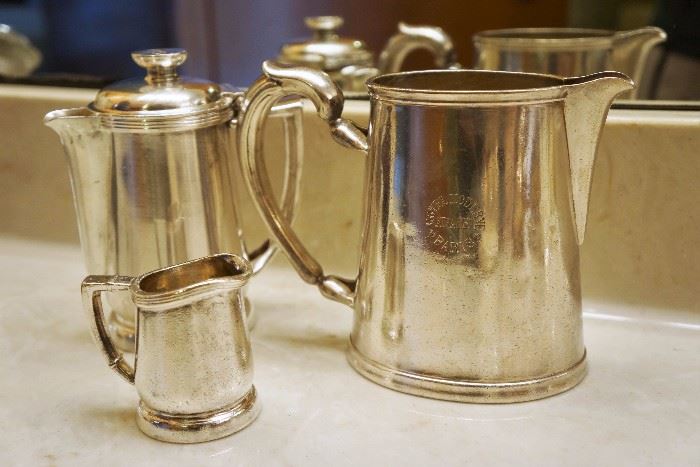Hotel Moderne in Paris pitcher by Christofle on the right. The small creamer and pitcher to the left are from the Statler Hilton 