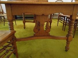 beautiful table with 4 leaves and 6 caned chairs.