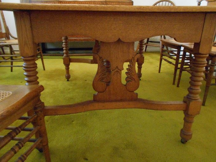 beautiful table with 4 leaves and 6 caned chairs.
