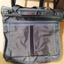 light blue man's suit or woman's dress handing bag to travel ($20.00)