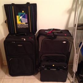 Black suitcase; 18"x28" ($20.00),  16"x25" ($15.00), business ($($10.00), NBAA2005 traveler bag ($5.00).