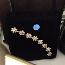 black purse with gold flower along edge ($5.00)