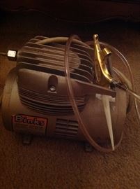 Vintage Air Compressor by Binks. There are attachments that come with it