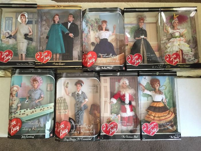 Several different "I Love Lucy" Barbies. All are new in the box!