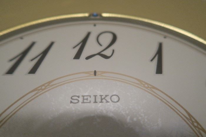 Seiko Wall Clock with Swarovski Crystal, also Chimes and plays music every hour on the hour.  Measures approximately 21 1/4'' H x 9 1/2'' W x 3 1/4''