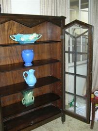 Pottery in Mission-era book case