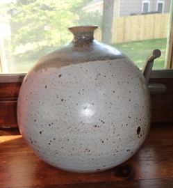 Several pieces of handmade pottery, signed by the artists.