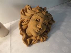 We have two similar versions of this lovely lady's face - one is an outdoor wall hanging and this one looks as though she's never been outside.