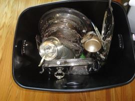 Tote full of plated silverware.