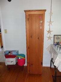 Tall pie cupboard or kitchen storage cupboard.