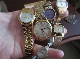 THERE IS A LARGE ASSORTMENT OF JEWELRY