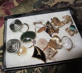 THERE IS A LARGE ASSORTMENT OF JEWELRY