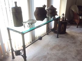 Wrought iron and glass table, vintage pottery