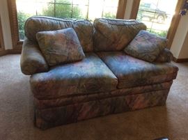 Love seat with watercolor print fabric 