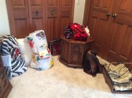 Colorful bedding and blankets, including vintage wool plaid throws 