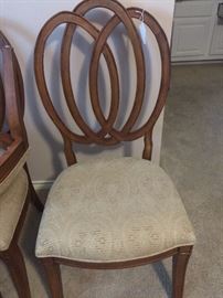 One of six matching dining chairs