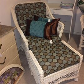 White wicker chair and ottoman with teal & brown cushions