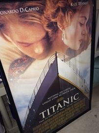 Framed movie posters including Titanic, Gone With the Wind, Moulin Rouge, Braveheart, The Phantom of the Opera, and Pirates of the Caribbean.