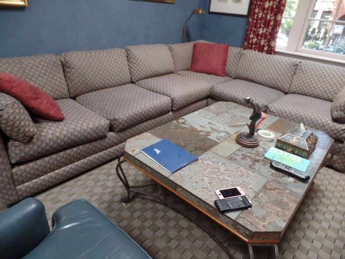 Large sectional sofa. One more armless piece too. Coffee table and items on top not for sale