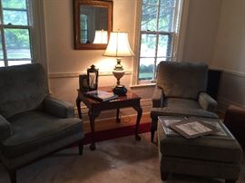 Pair of arm chairs with ottoman, side table, mirror, lamp and iron candle holder