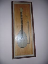 Wen Chin musical instrument on wood