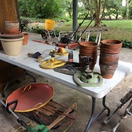 Flower pots, sprinklers, Briggs&Stratton lawn mower, fertilizer spreader, sleds, weed eater