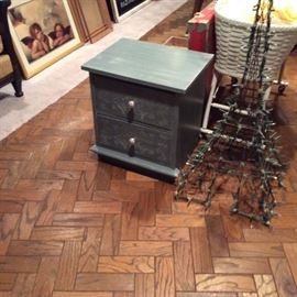 Great little chest that has been redone & painted - ready for a new home. That's an Eiffel Tower replica with lights beside the chest!