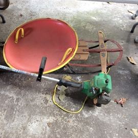 Old wooden sled, disk sled, weed eater