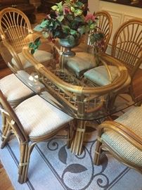 Rattan and glass top oval table with 6 chairs