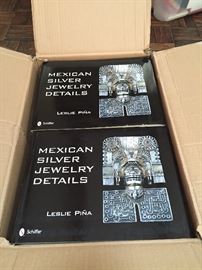 A variety of books signed by Leslie Pina