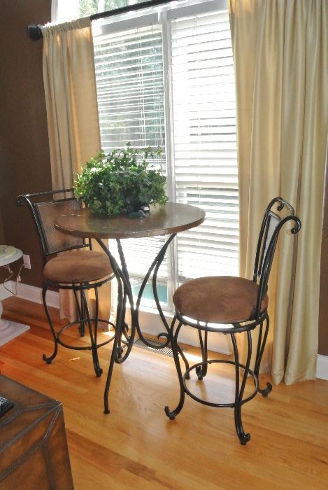 copper top table and leather chairs