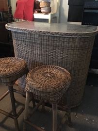 very nice wicker and glass bar with 2 stools