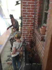 Look at the little flower pots on the window sill and the manhole covers! Detail is astonishing!