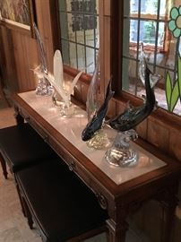 White marble top console table with two stools that fit underneath