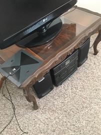 stereo system, vintage tea/coffee table with glass top. (TV not for sale)