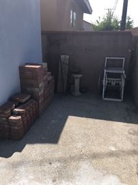 bricks, hose reel, birdbath base