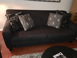 Klaussner charcoal couch and pillows.