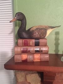 Lots of hand carved ducks and vintage books 