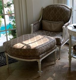 White trim chair and ottoman with nail head detail