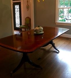 Hepplewhite style dining room table with pedestal legs