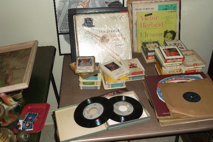 Joining the eight track tapes are vintage vinyl records, including a collection of Glenn Miller 45s.