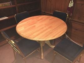 Small kitchen/dining table with four chairs