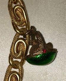 Notice the beautiful enameling and tiny gemstones.