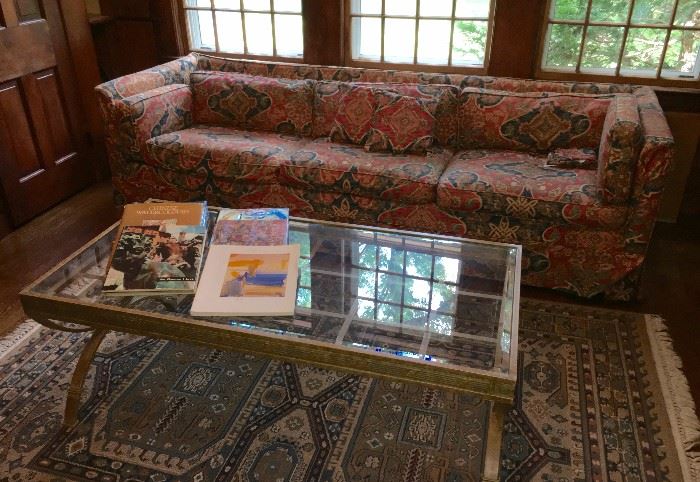 Heavy glass and metal coffee table and MCM sofa