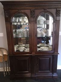 fine china cabinet packed with crystal and fine china